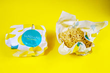 Load image into Gallery viewer, Left to right. A Honeycomb sponge packaged, then the package opens revealing a large honeycomb sponge
